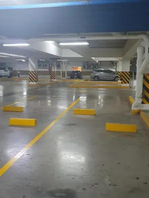 a parking garage with a car parked in it at Condominium Shore 1 Mall of Asia in Manila