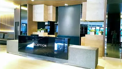 a lobby with a reception desk in a building at Condominium Shore 1 Mall of Asia in Manila