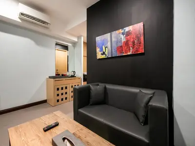 a living room with a couch and a table at Bay Area Suites Manila in Manila