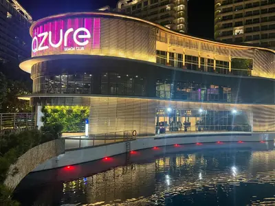 a building with a sign on the side of it at Azure Urban Resort Residences, Condo, Manila Airport, Wave-Pool, Tropical Vibe in Manila
