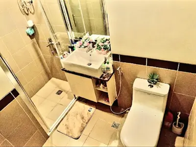 a bathroom with a toilet and a sink at 1BR Near Beach, Airport & In City of Manila Bay in Manila