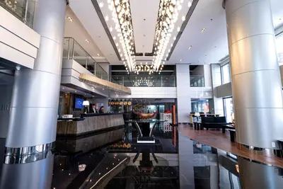 a lobby of a hotel with a bar at Coro Hotel in Manila