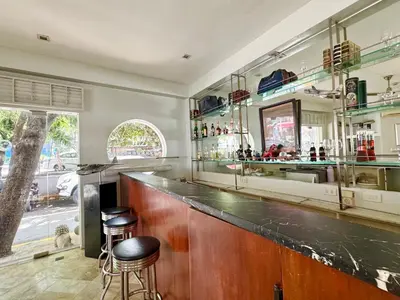 a bar with two stools in a room at The Clipper Hotel, Poblacion Makati in Manila