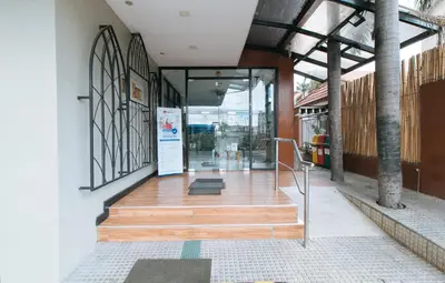 a building with a staircase leading to a door at RedDoorz Plus at MM Hotel Las Pinas former RedDoorz Plus Near Bamboo Organ in Manila