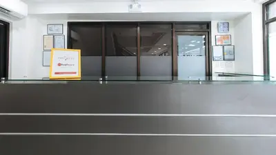 a glass counter with a sign in front of a building at RedDoorz Plus at Evangelista Street Makati in Manila