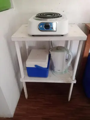 a white shelf with a toaster on top of it at Mia and Miguel's House in General Trias