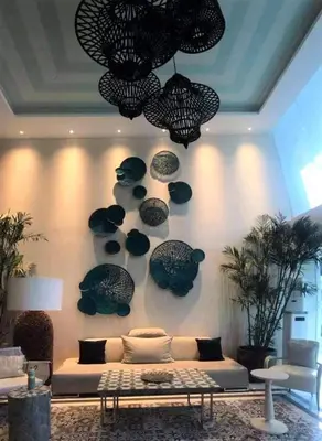 a living room with a couch and some fish on the wall at AZURE Urban Resort Residences 1BR Condo with huge wavepool & man-made beach near Airport in Manila