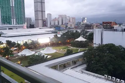 a view of a city from a building with buildings at MANDALUYONG 2 Br w 2 Queen, 50HDtv across Shangrila Mall in Manila