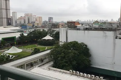 a view of a city from a building at MANDALUYONG 2 Br w 2 Queen, 50HDtv across Shangrila Mall in Manila