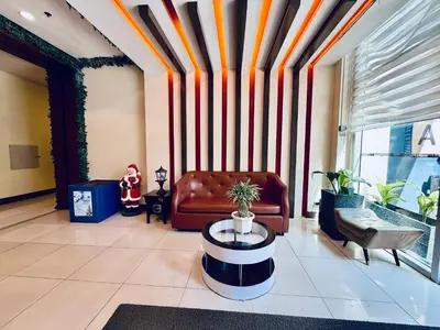 a living room with a couch and a table at One Palm Tree Villas across NAIA-T3 in Manila
