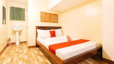 a bedroom with a bed in a room at RedDoorz near PNR Espana Station in Manila