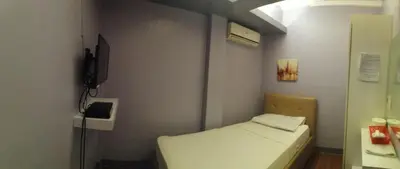 a small room with a small bed in it at ANNELENA INN in Manila