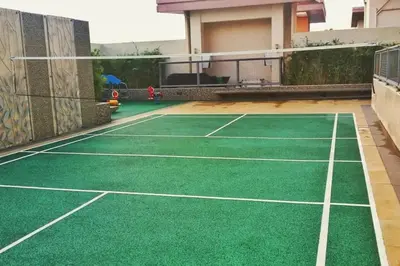 a tennis court in the middle of a house at Modern Stylish Condo in Morgan Suites McKinley with Wi-Fi in Manila