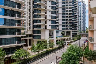 an apartment building with a street in front of it at Modern Stylish Condo in Morgan Suites McKinley with Wi-Fi in Manila