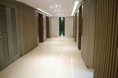 a hallway of a building with white floors and walls at A SPECIAL PLACE Shore Residences in Manila
