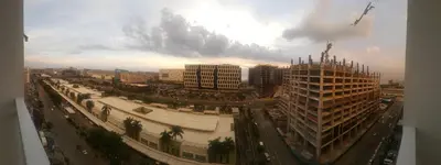 an aerial view of a city with buildings and traffic at A SPECIAL PLACE Shore Residences in Manila