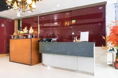 a large kitchen with a counter in a building at Lucky Hotel Binondo in Manila
