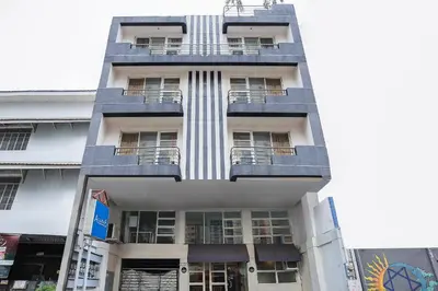 a tall building with balconies on the side of it at Alley 8 Makati in Manila