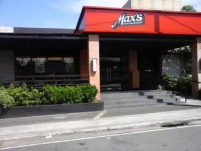 a mcdonalds restaurant with a red roof and stairs at 1BR Interiored Condo with WiFi, Netflix, Hot Shower - The Hive Residences in Taytay
