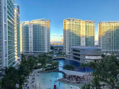 a view of a city with tall buildings at Manila Urban Resort at Azure in Manila