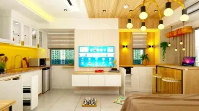 a kitchen with a flat screen tv in it at Manila Urban Resort at Azure in Manila