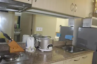 a kitchen with a sink and a counter top at Chateau Elysee a14 near Airport Wifi Kitchen in Manila