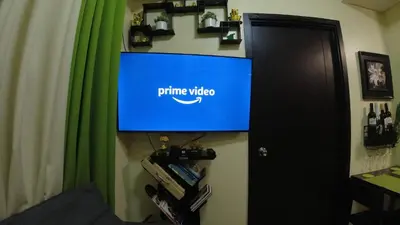 a tv on a wall with a puma video sign on it at A Refreshing Condo Unit Near BGC, Ortigas & Makati with NETFLIX and WiFi in Manila