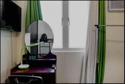 a mirror sitting on a desk in a room at A Refreshing Condo Unit Near BGC, Ortigas & Makati with NETFLIX and WiFi in Manila