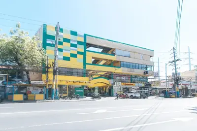 a colorful building on the side of a street at RedDoorz near SM City Muntinlupa in Manila