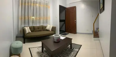 a living room with a couch and a coffee table at Matchi in Manila