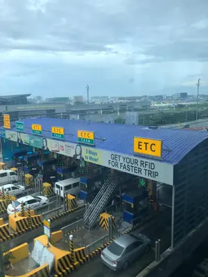 a car parked in front of a gas station at Favila Condotel unit in Palmtree Villas Newport City walking distance to Airport terminal 3 Accessable to Airport terminal 1 &2 in Manila