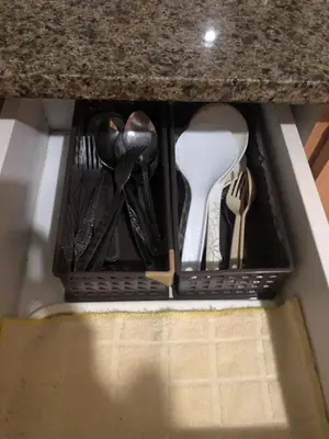 a drawer in a kitchen counter with utensils at Favila Condotel unit in Palmtree Villas Newport City walking distance to Airport terminal 3 Accessable to Airport terminal 1 &2 in Manila