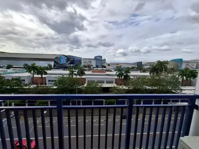 a view of a city from a balcony at King of kings at SEA RESIDENCES in Manila