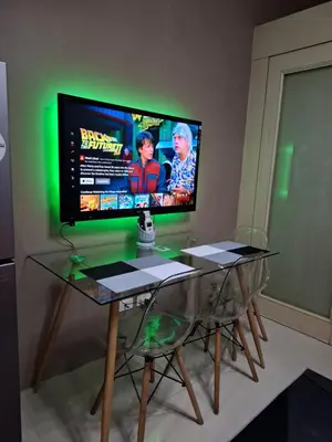 a television sitting on top of a glass table at King of kings at SEA RESIDENCES in Manila