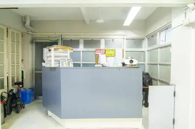 a room with a blue counter in a room at ARK Hostel City Center Manila in Manila