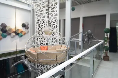 a chair in the middle of a building at ARK Hostel City Center Manila in Manila