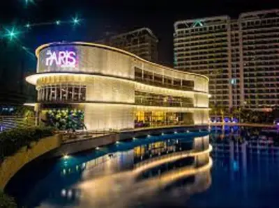 a large building with a sign on it at night at AZURE C1 with balcony wifi MULTIPLE UNITS near airport in Manila