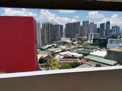 a view of a city skyline from a building at U607 Sunshine100 Netflix 65InchesTV Wifi Karaoke Swimming Pool in Manila