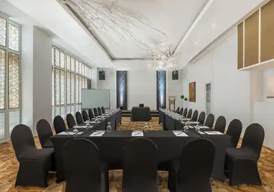 a conference room with rows of tables and chairs at Vivere Hotel and Resorts in Manila