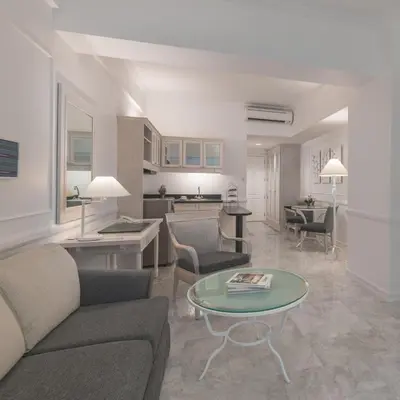 a living room with a couch and a table at Vivere Hotel and Resorts in Manila