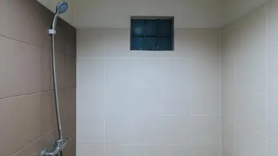 a bathroom with a shower with a window at RedDoorz near SM Calamba in Laguna