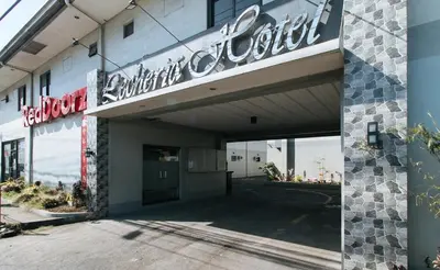 an entrance to a building with a sign on it at RedDoorz near SM Calamba in Laguna