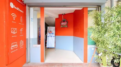 an entrance to a building with colorful walls at RedDoorz @ P Florentino Street Sampaloc Manila in Manila