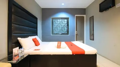 a small bedroom with a bed with a black headboard at RedDoorz @ P Florentino Street Sampaloc Manila in Manila
