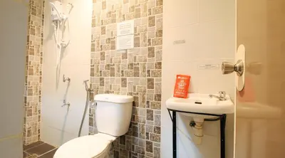 a bathroom with a toilet and a sink at RedDoorz @ P Florentino Street Sampaloc Manila in Manila