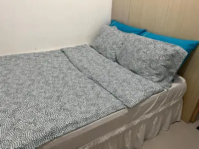 a bed with two pillows on top of it at 1BR Jazz Bel-air Makati, POOLVIEW, TRIDENT in Manila
