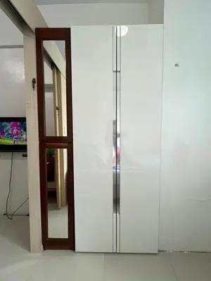 a white cabinet with a door in a room at 1BR Jazz Bel-air Makati, POOLVIEW, TRIDENT in Manila