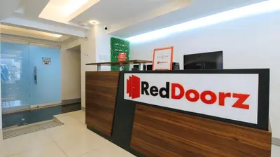 a red door store with a sign on it at RedDoorz Plus @ San Marcelino Malate in Manila
