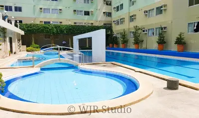 a swimming pool in the middle of a building at Centropolis King Bed Deluxe in Manila