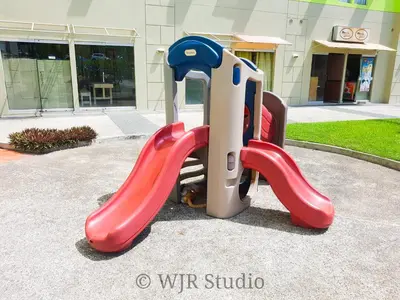 a slide with a cat laying on it at Centropolis King Bed Deluxe in Manila